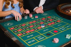 Three Card Poker betting layout showing ante, raise, and Pair Plus bet positions